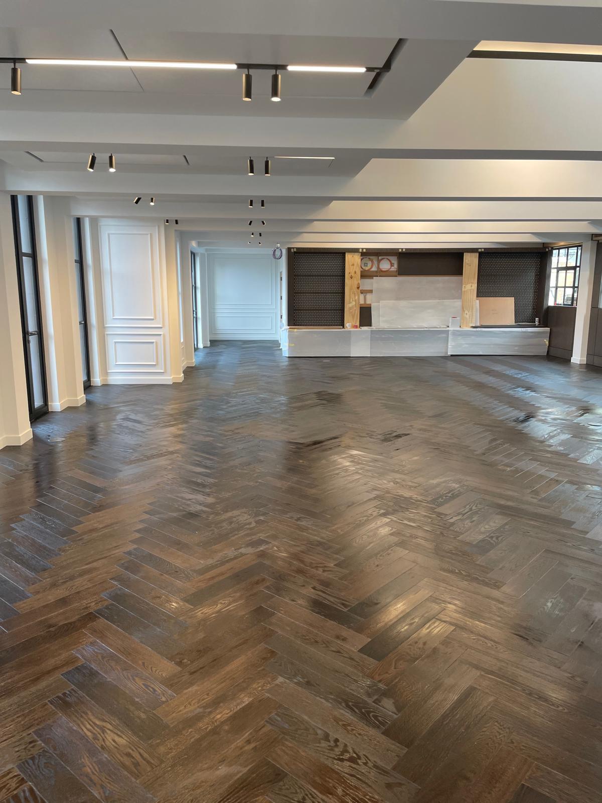 Large herringbone flooring installation