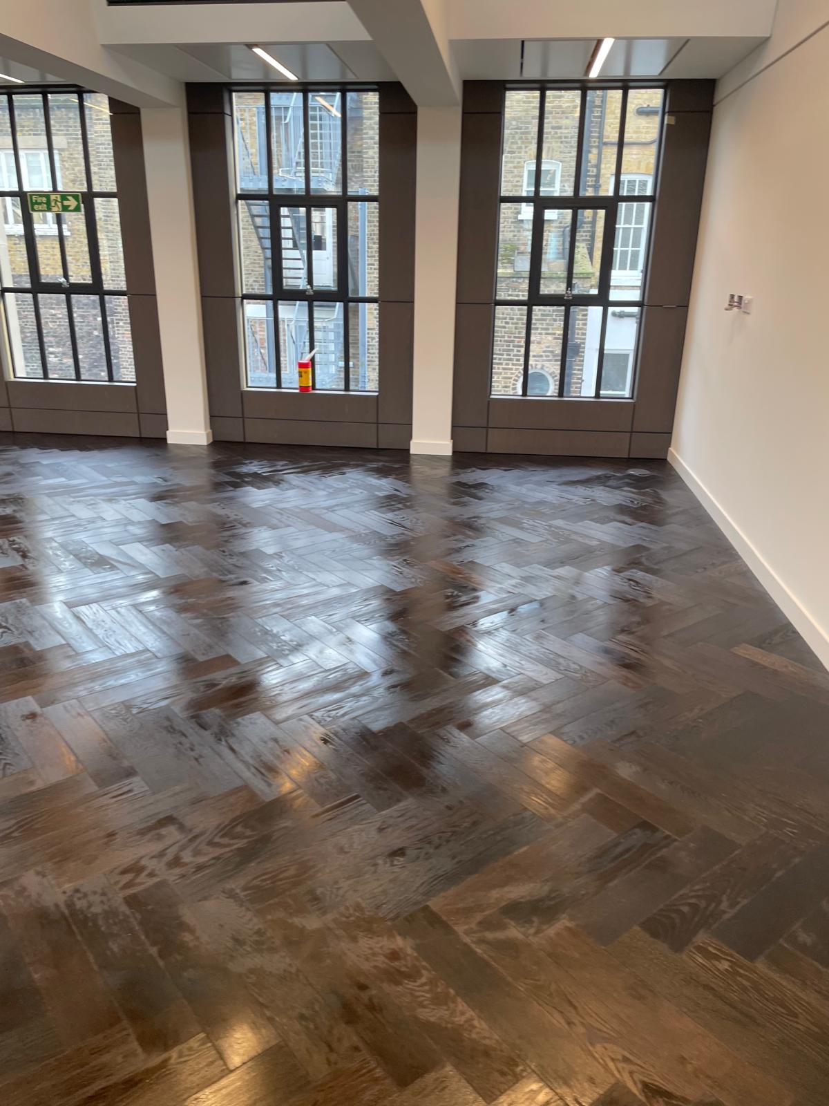 Polished flooring finish across a period room